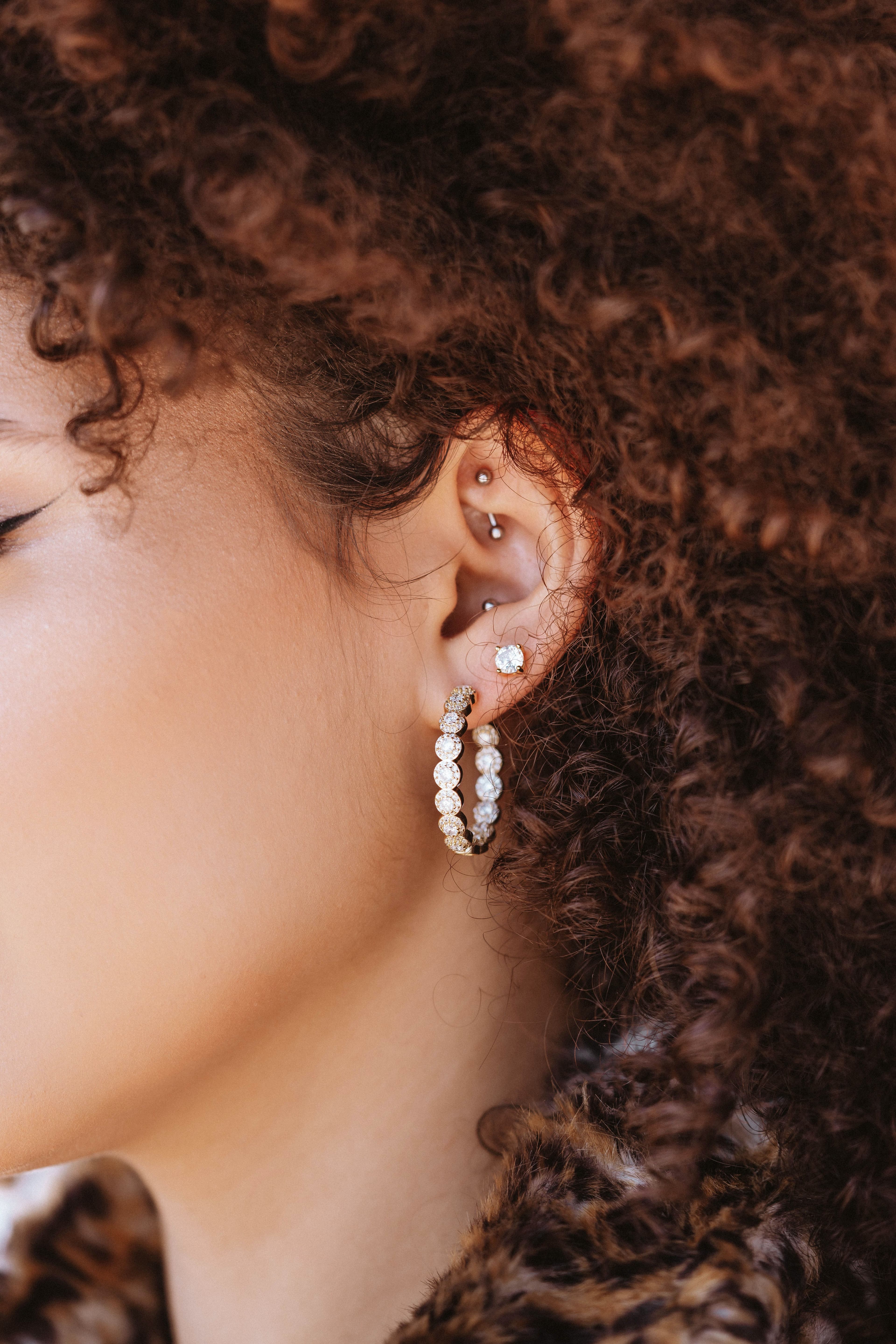 Upper ear, lower ear, and mid ear piercing on a model in American Fork, UT